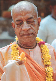 Srila Prabhupada with flower