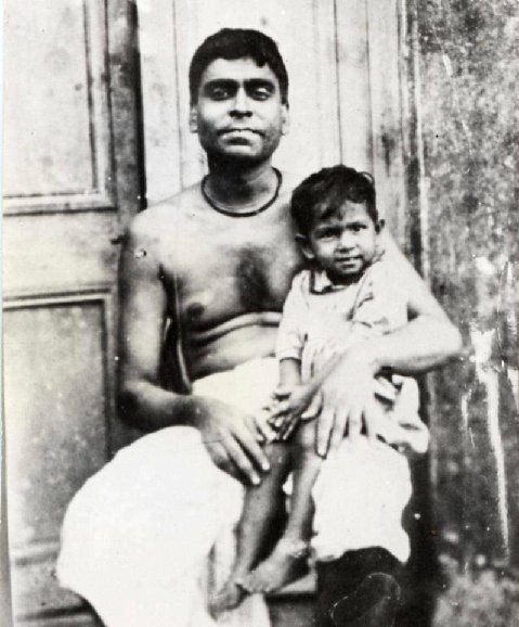 Srila Bhaktivinoda holding young Bhaktisiddhanta