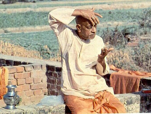 Srila Prabhupada putting on tilak